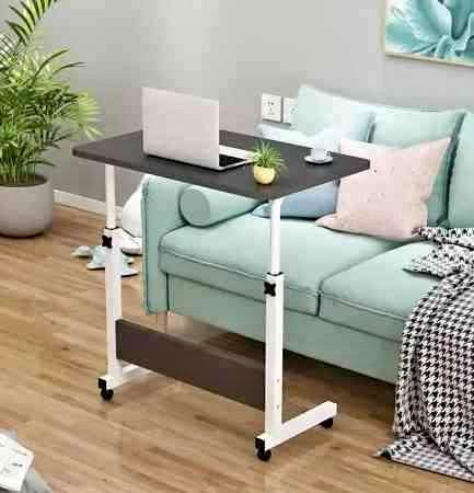 Adjustable and moveable table